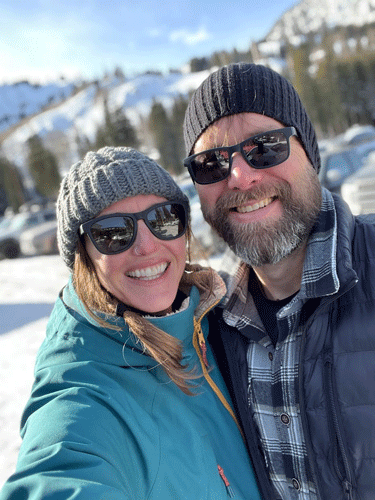 Melissa in a snowy landscape with her husband.
