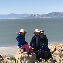 Elizabeth Callaway sits with her daughters on the Great Salt Lake shore
